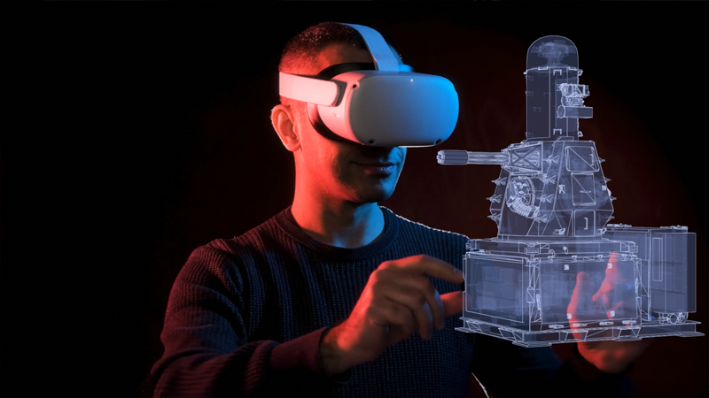 Man wearing VR headset interacting with CWIS wireframe