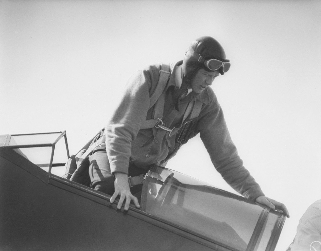 Charles Lindbergh climbs into the open cockpit of his Sirius.