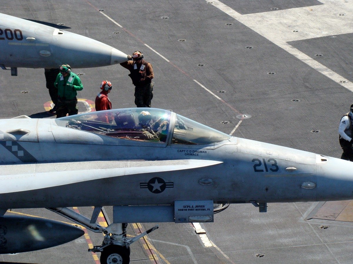 French on the flight deck of the USS Ronald Reagan, preparing for a cat shot in the F-18.