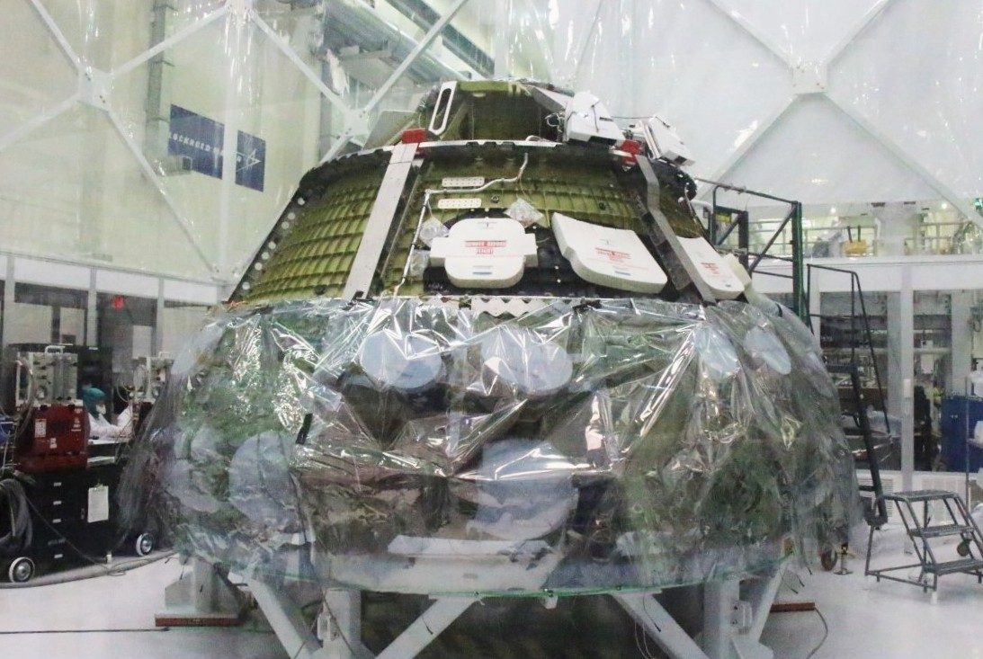 Orion for Artemis II inside the clean room during power on and assembly.